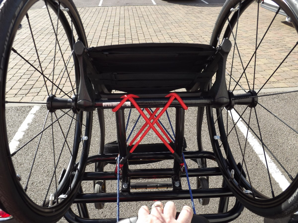 Casarva Rocket 111 trike with disability adaptations. Reverse gearbox, raked front forks to make steering lighter, rigid frame wheelchair rack, Kliktronic gear shifter, K Lever2 twin brake levers, Footplates with back stops and velcro straps, Lap belt, reupholstered seat with special foam insert.